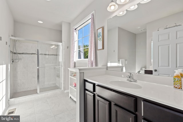 bathroom with vanity and an enclosed shower