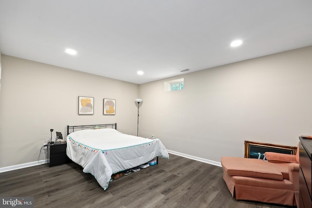 bedroom featuring dark hardwood / wood-style flooring