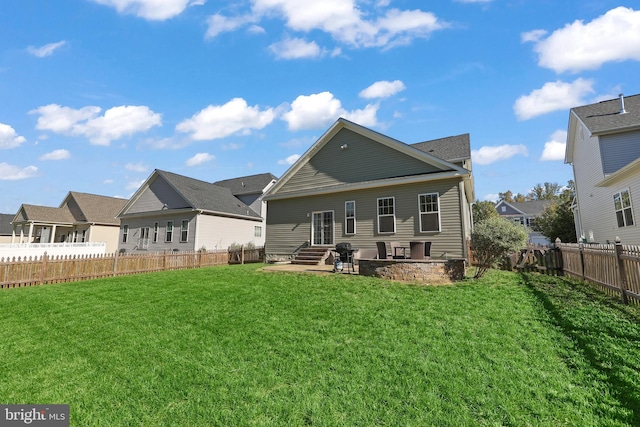 rear view of property with a patio area and a lawn