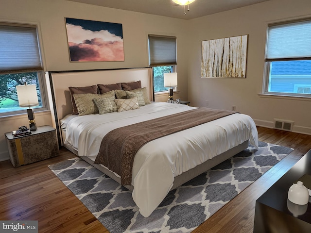 bedroom featuring dark wood-type flooring