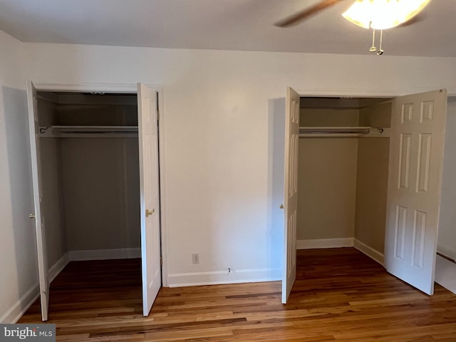 unfurnished bedroom featuring hardwood / wood-style floors and ceiling fan