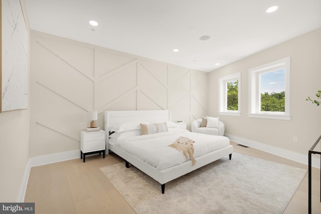 bedroom with light wood-type flooring