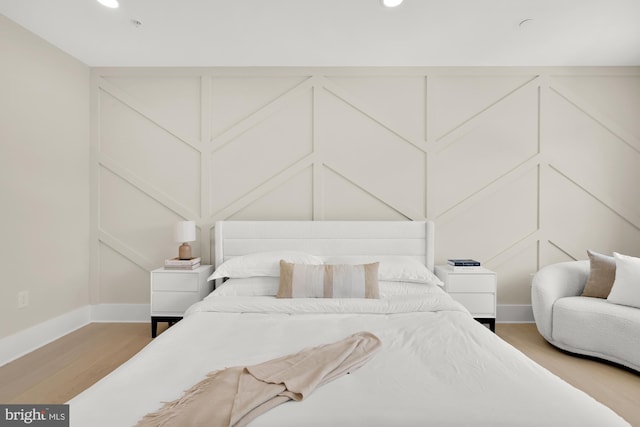 bedroom featuring hardwood / wood-style floors