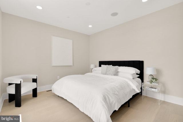 bedroom with light hardwood / wood-style flooring