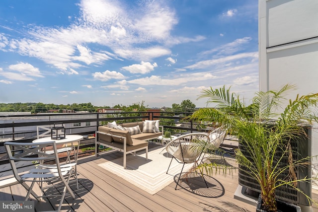 deck featuring outdoor lounge area