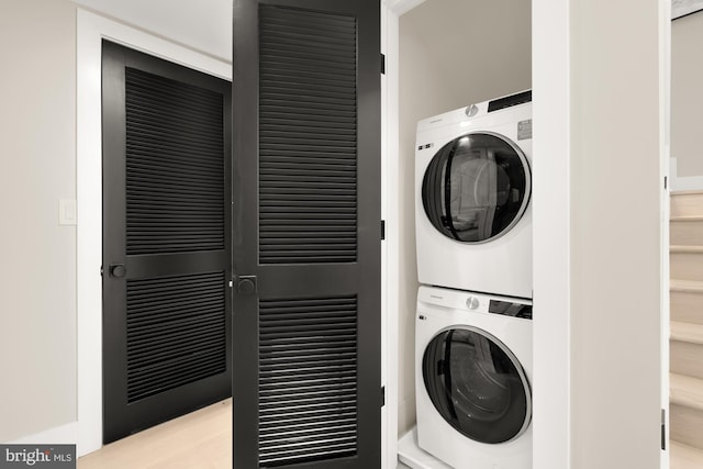 washroom with stacked washer and dryer