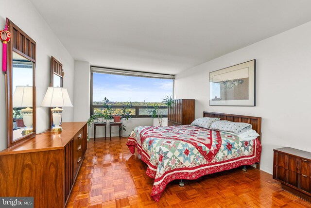 bedroom with parquet flooring