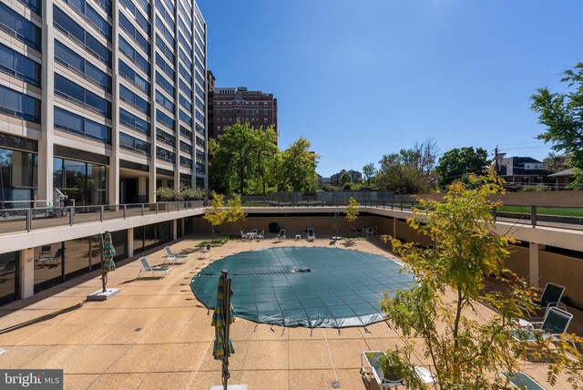 view of swimming pool featuring a patio