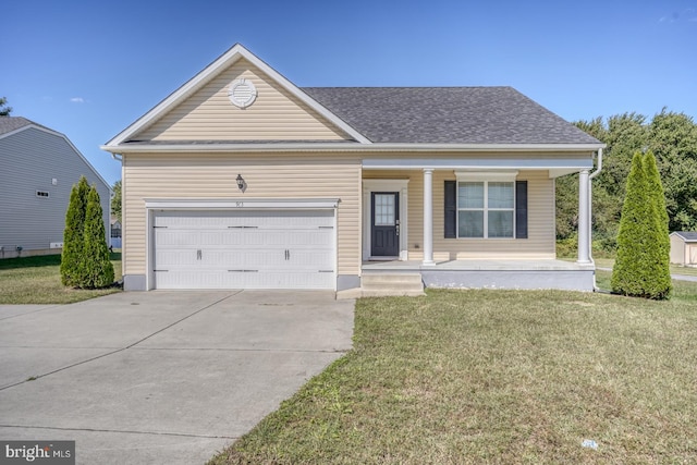 view of front of house featuring a front lawn, covered porch, and a garage