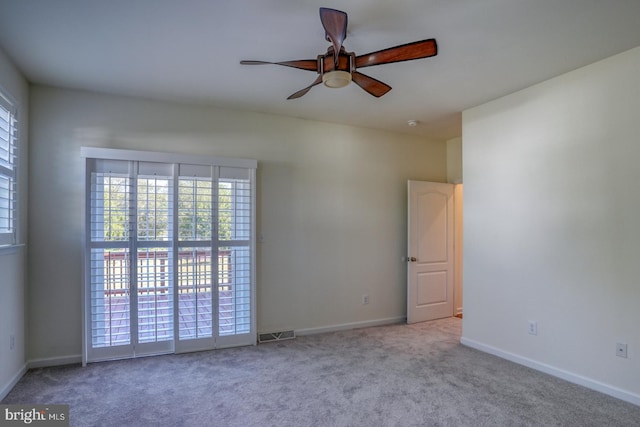 carpeted empty room with ceiling fan