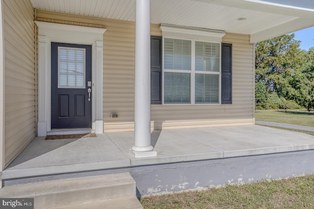 doorway to property with covered porch