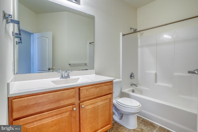 full bathroom with tile patterned floors, vanity, toilet, and  shower combination