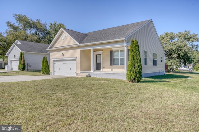 view of front of house featuring a front yard and a garage