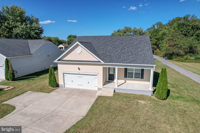 view of front of house featuring a garage and a front yard