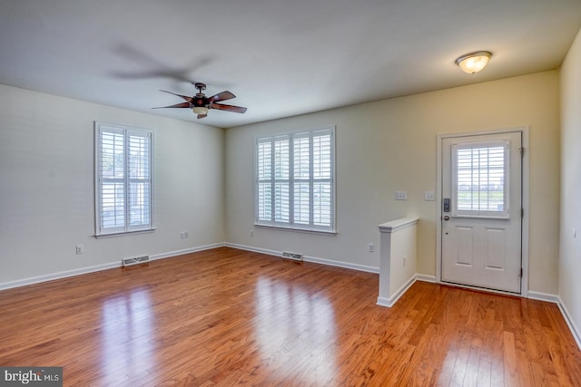 entryway featuring plenty of natural light, light wood-type flooring, and ceiling fan