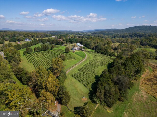 drone / aerial view featuring a mountain view and a rural view