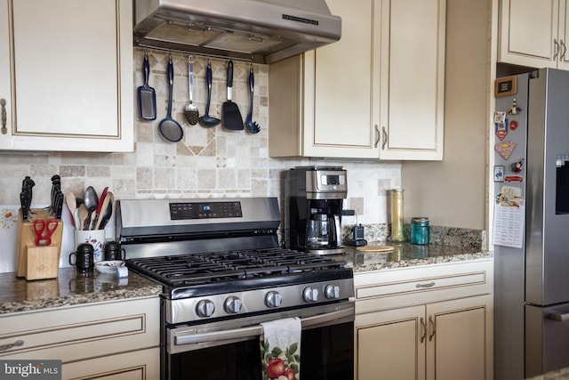kitchen featuring tasteful backsplash, appliances with stainless steel finishes, range hood, and light stone countertops