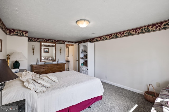 bedroom with carpet flooring and a textured ceiling