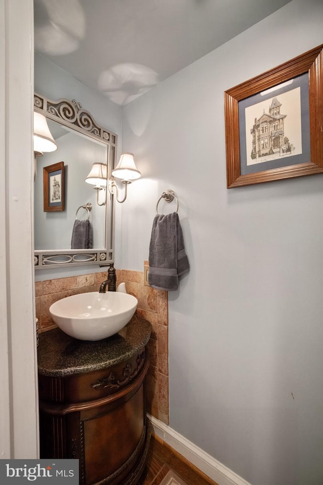 bathroom with vanity and wood-type flooring