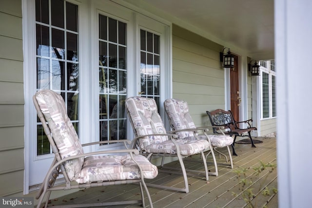 wooden terrace featuring a porch