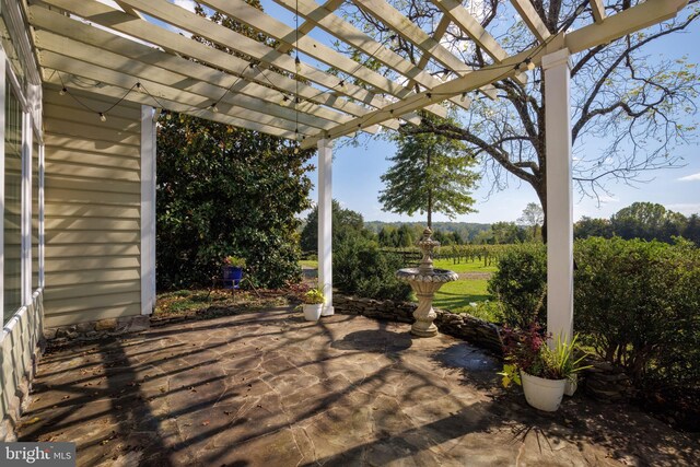 view of patio featuring a pergola