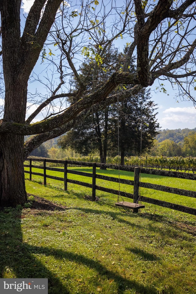 view of yard with a rural view