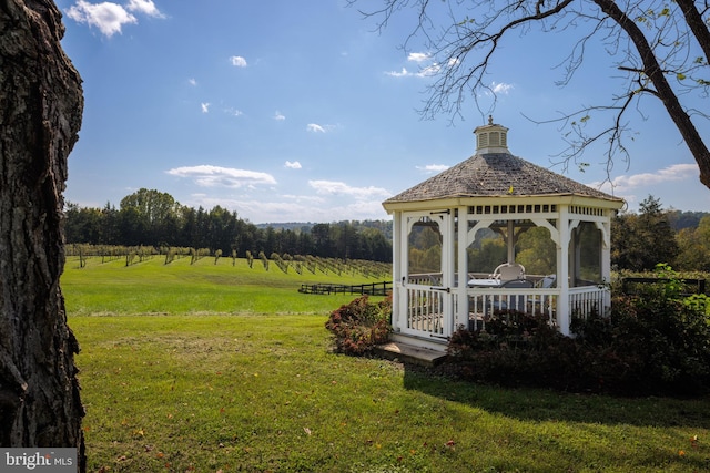 view of yard featuring a rural view and a gazebo