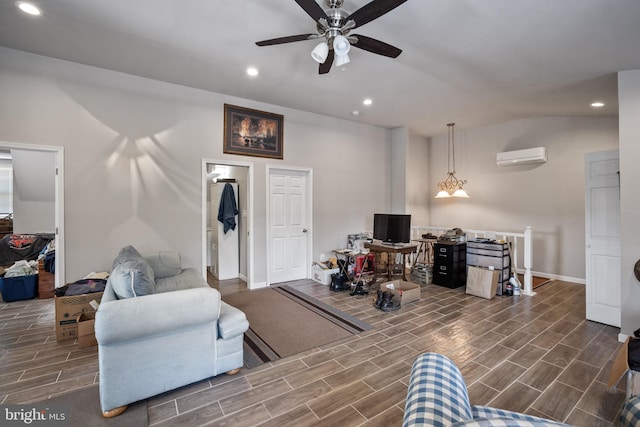 living area with a ceiling fan, a wall mounted AC, wood finished floors, and recessed lighting