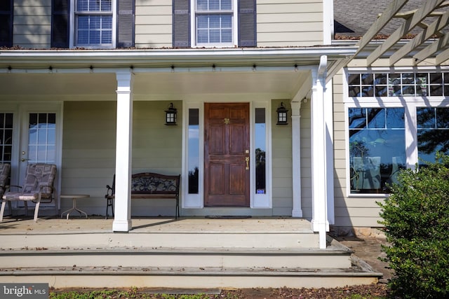 entrance to property with a porch