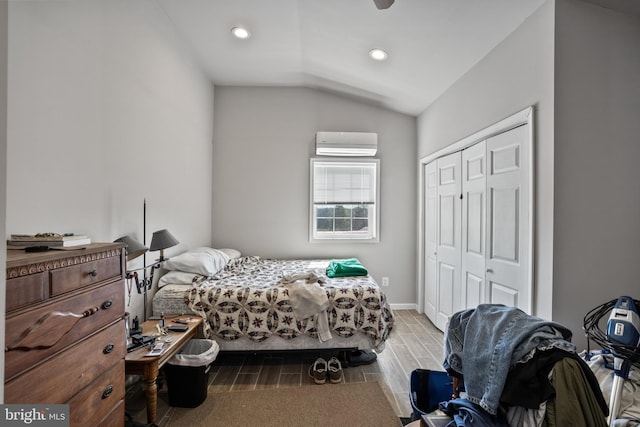 bedroom with a wall mounted AC, a closet, recessed lighting, wood tiled floor, and lofted ceiling