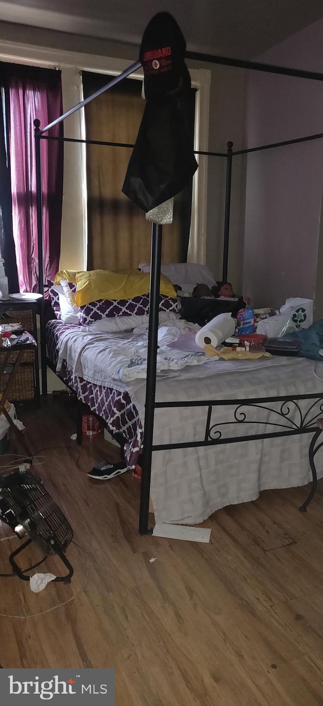 bedroom featuring wood-type flooring