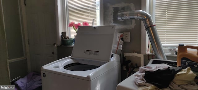 clothes washing area with independent washer and dryer