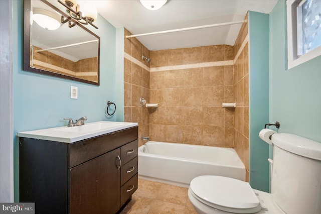 full bathroom with vanity, toilet, and tiled shower / bath