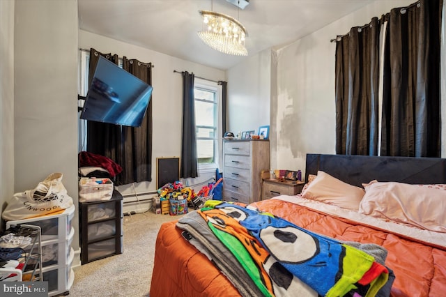 bedroom featuring a chandelier and carpet flooring