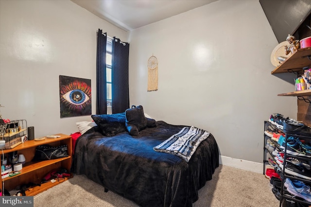 bedroom featuring light colored carpet