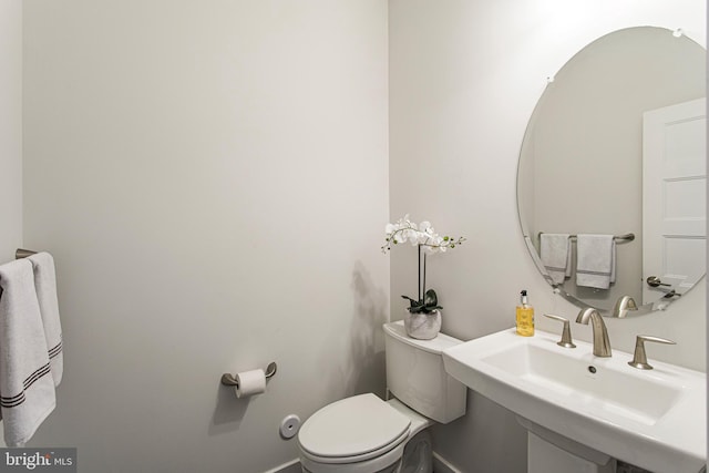 bathroom with sink and toilet