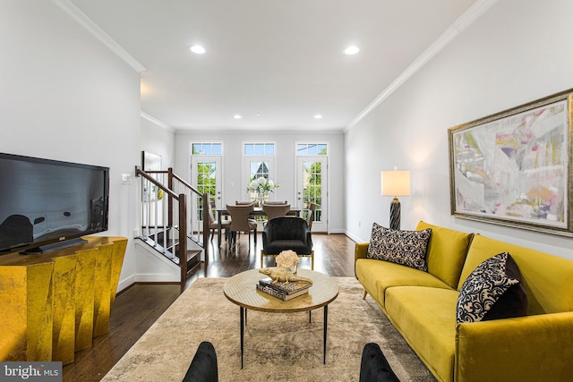 living room featuring crown molding and dark hardwood / wood-style flooring