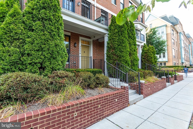 doorway to property featuring a balcony