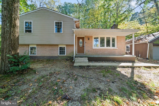 tri-level home featuring a patio