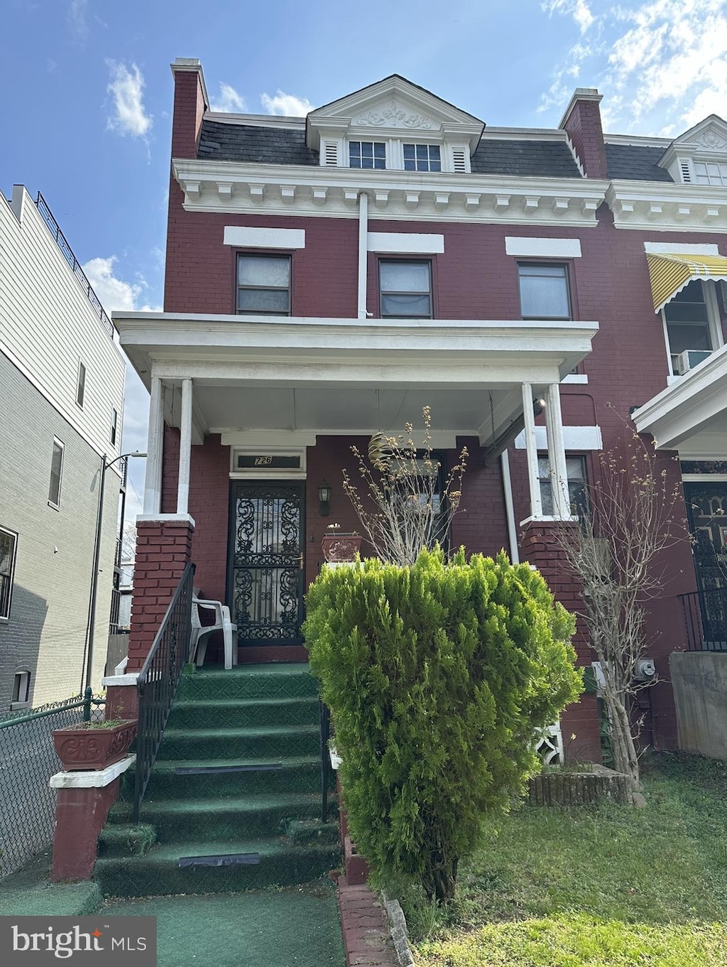 townhome / multi-family property with covered porch