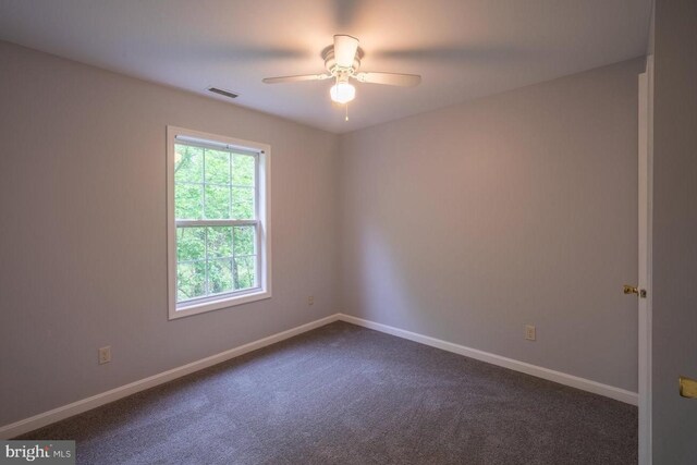 empty room featuring carpet and ceiling fan