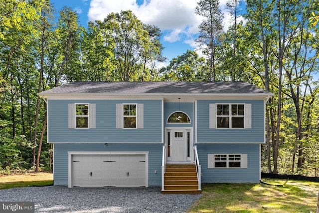 raised ranch featuring a garage