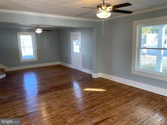 spare room featuring dark hardwood / wood-style floors and plenty of natural light