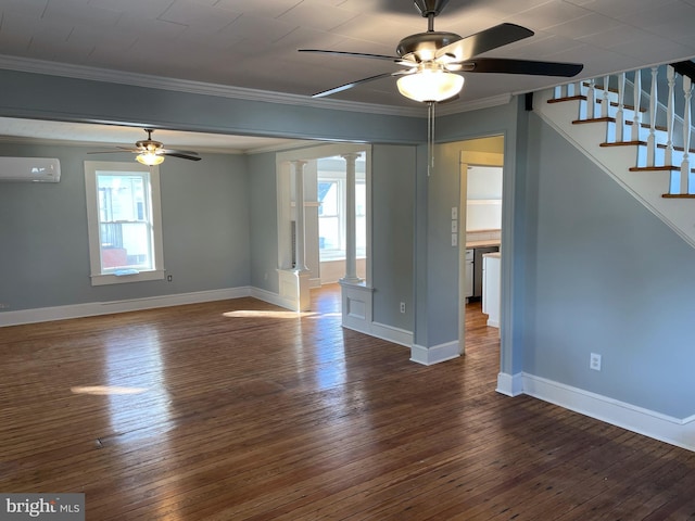 spare room featuring crown molding, a wall mounted AC, ornate columns, and dark hardwood / wood-style flooring