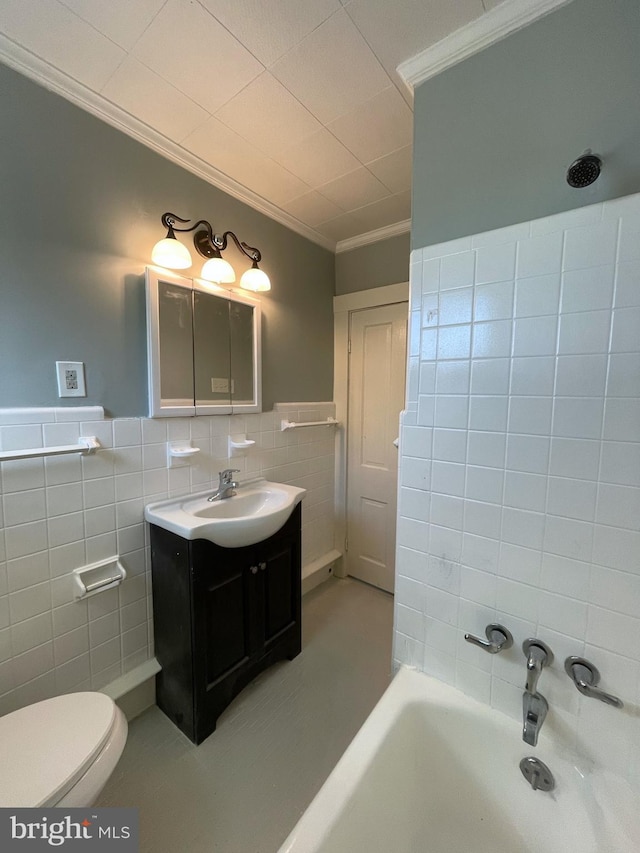 full bathroom featuring toilet, ornamental molding, tile walls, vanity, and shower with separate bathtub