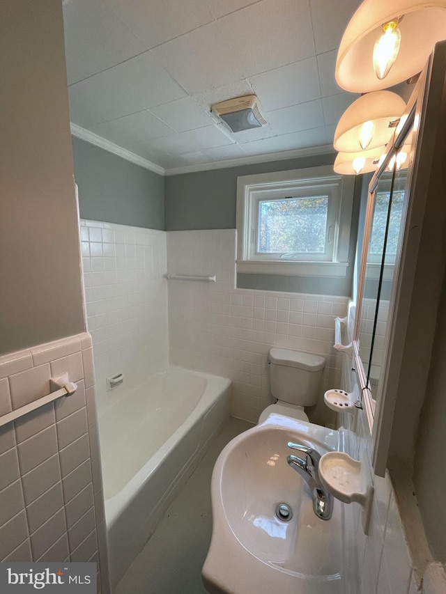 full bathroom featuring toilet, crown molding, plus walk in shower, and tile walls