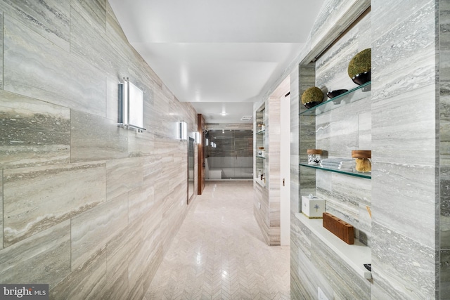 bathroom with tile walls