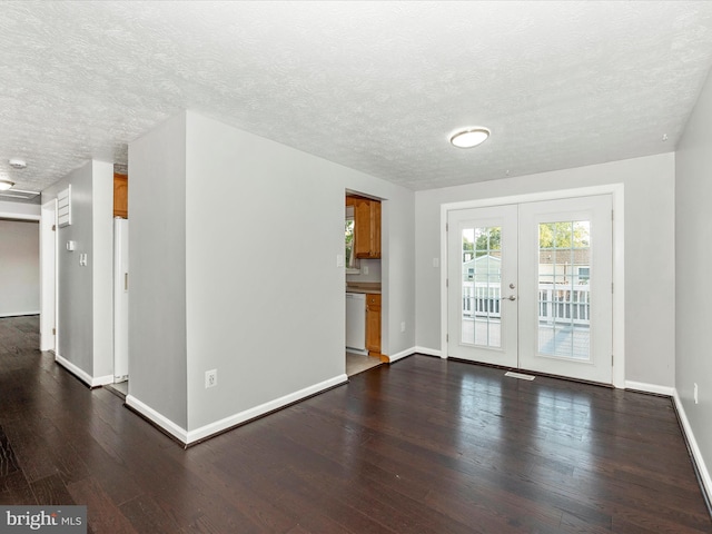 unfurnished room featuring french doors, dark hardwood / wood-style flooring, and a textured ceiling