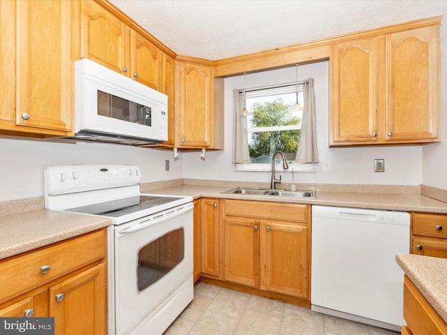 kitchen with sink and white appliances