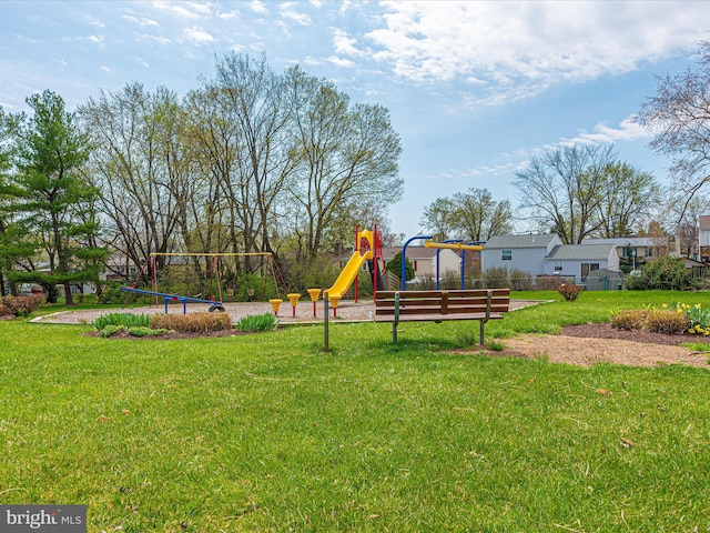 view of jungle gym featuring a lawn